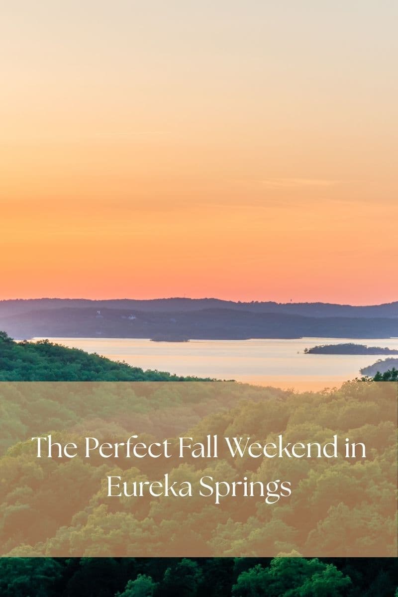 Sunset over a lake and forested Ozark hills