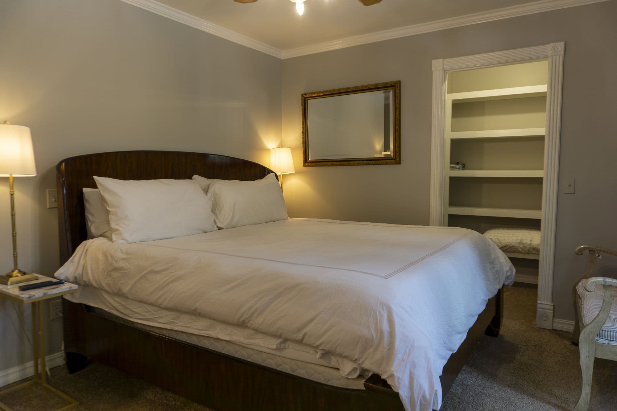 Twain Suite with a king bed and a curved wooden headboard