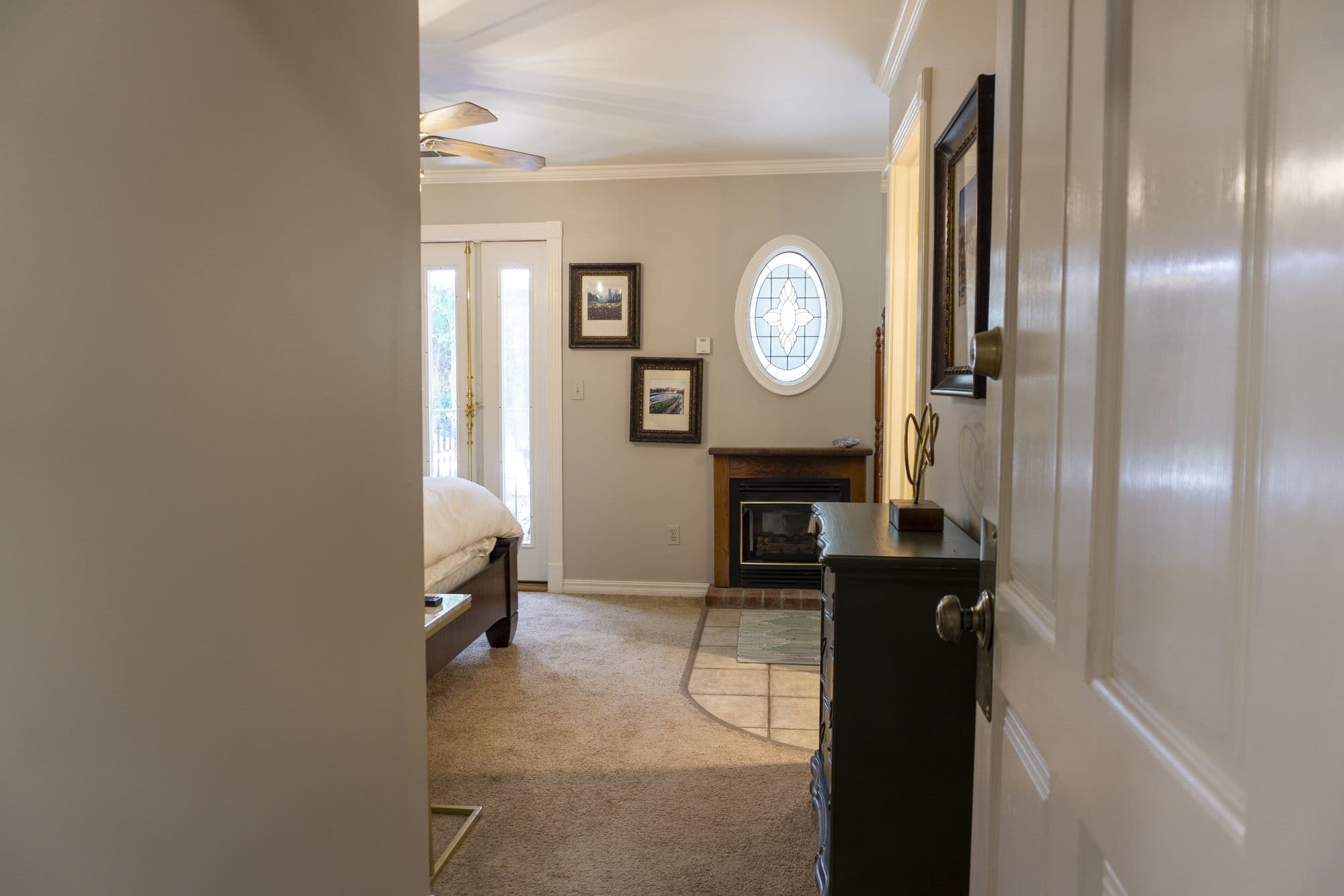 Looking into the Twain Suite, with its fireplace and oval stained glass window
